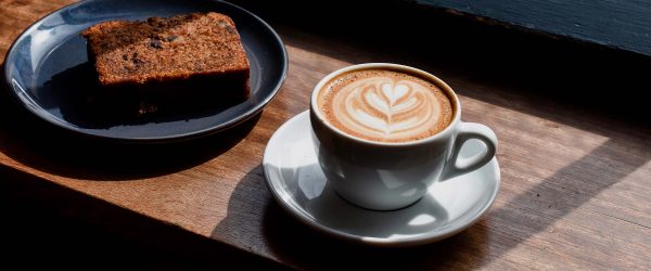 coffee-and-cake-on-cafe-counter-top-W695JTH.jpg